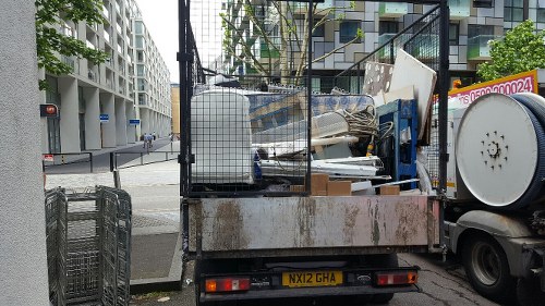 Low-emission vans parked at sustainable rubbish area in West London
